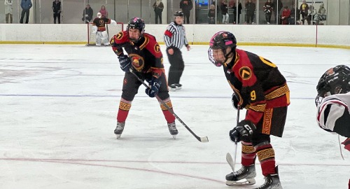 Hockey players skating on ice