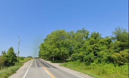 Speed sign stating 50 km an hour on road