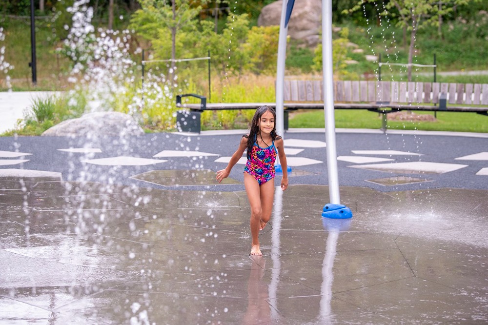 Girl using splash pad