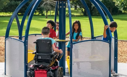 Kids using accessible play equipment