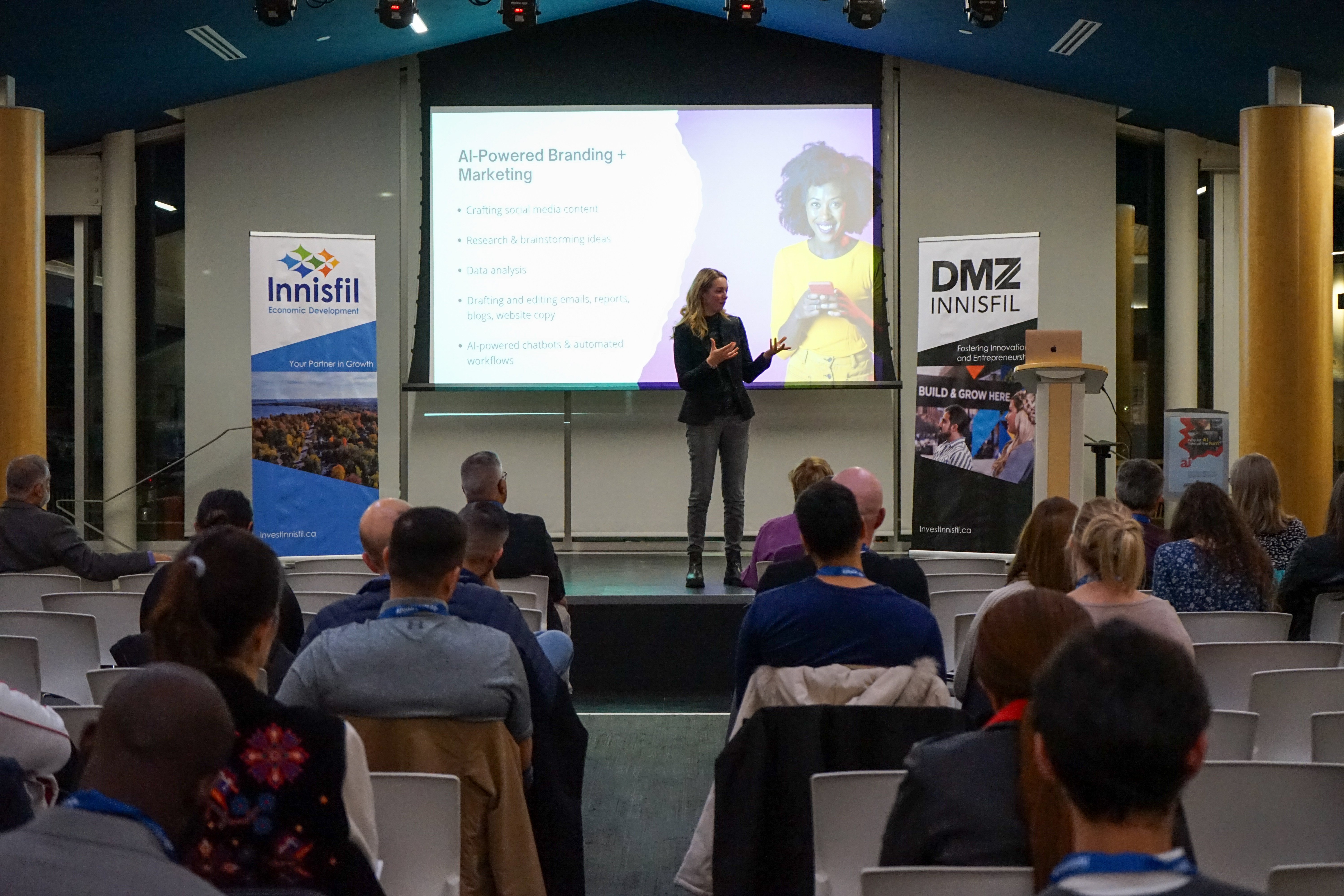 2024 Innisfil Business Showcase Speaker Image of Emily Baillie speaking about utilizing AI in marketing at the 2024 Innisfil Business Showcase event.