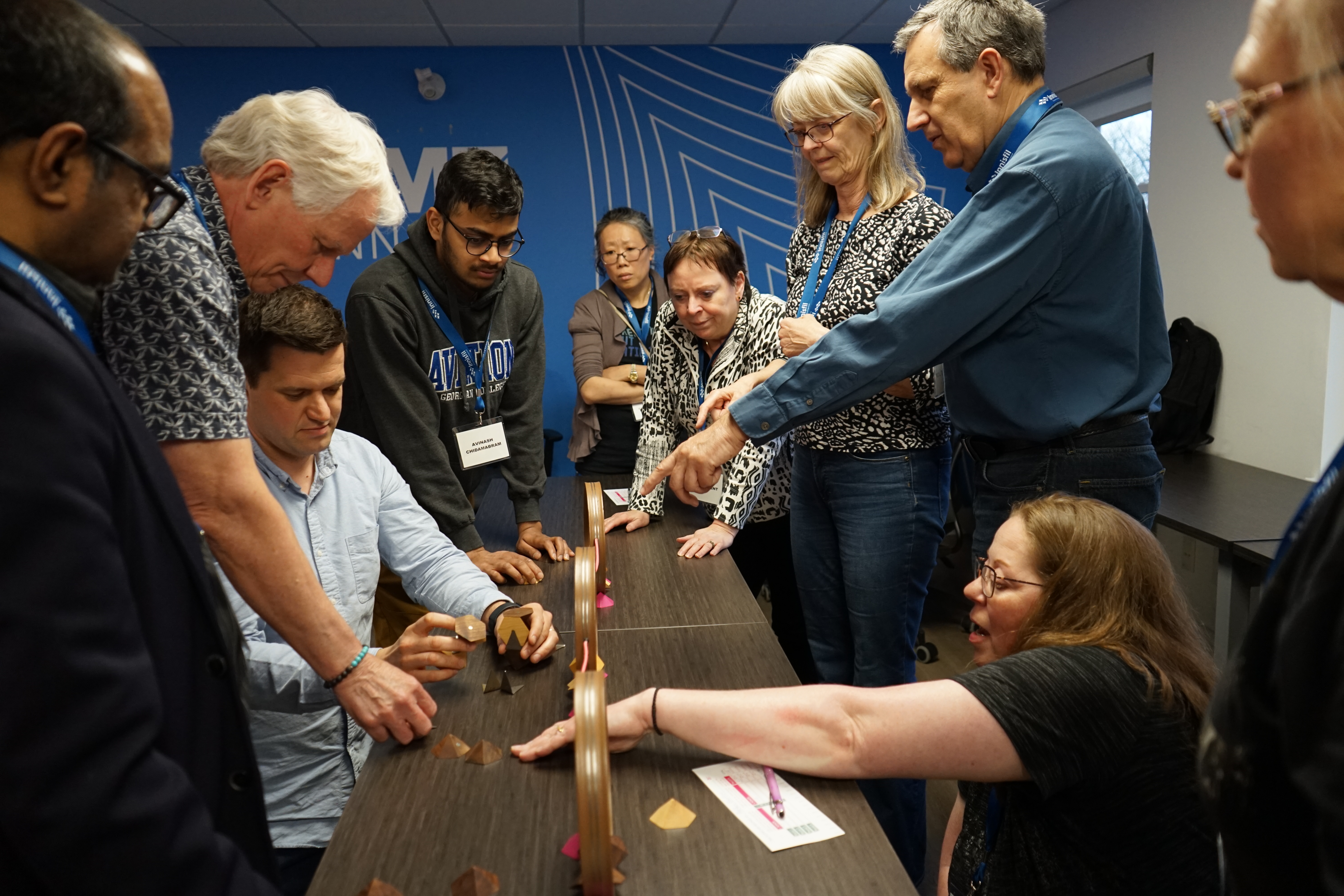 Group of DMZ Innisfil program participants interacting in a workshop at DMZ Innisfil Office