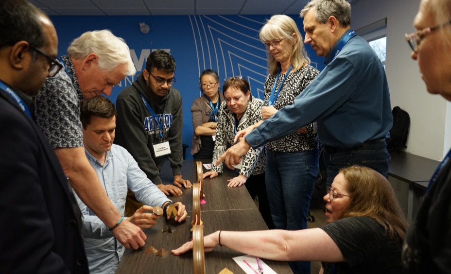 Group of DMZ Innisfil program participants interacting in a workshop at DMZ Innisfil Office