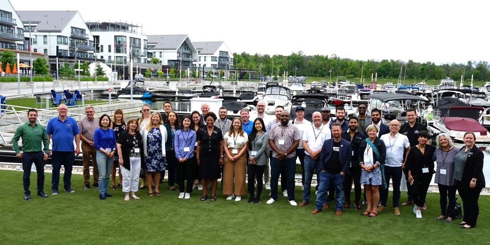 Group of entrepreneurs standing in front of Friday Harbour marina