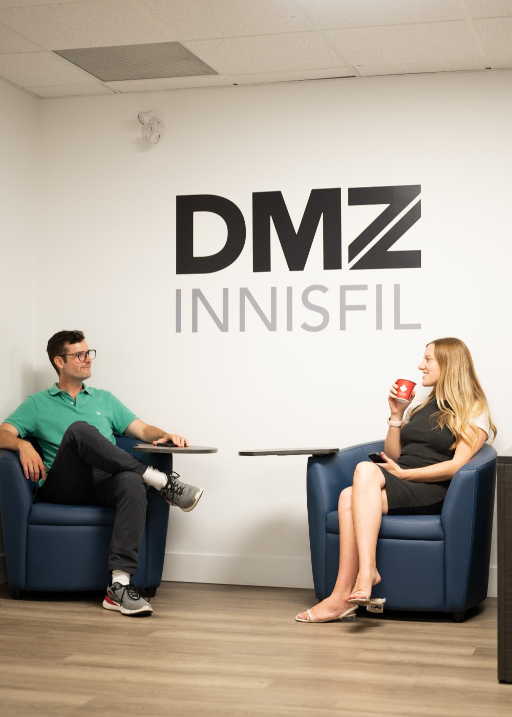 Two people talking with the words DMZ above them