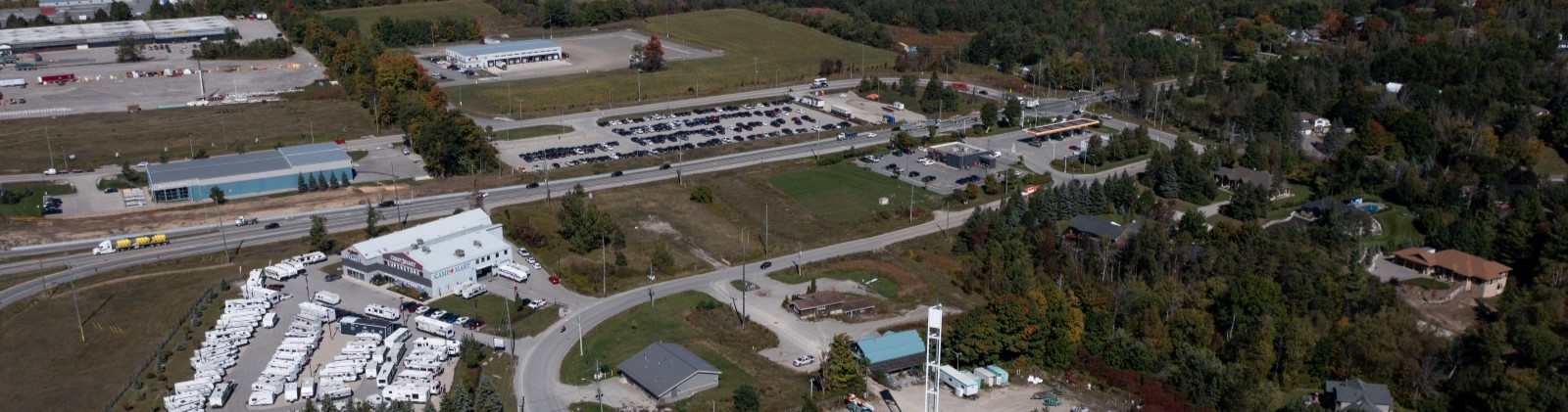 Aerial view of industrial park off highway in Innisfil