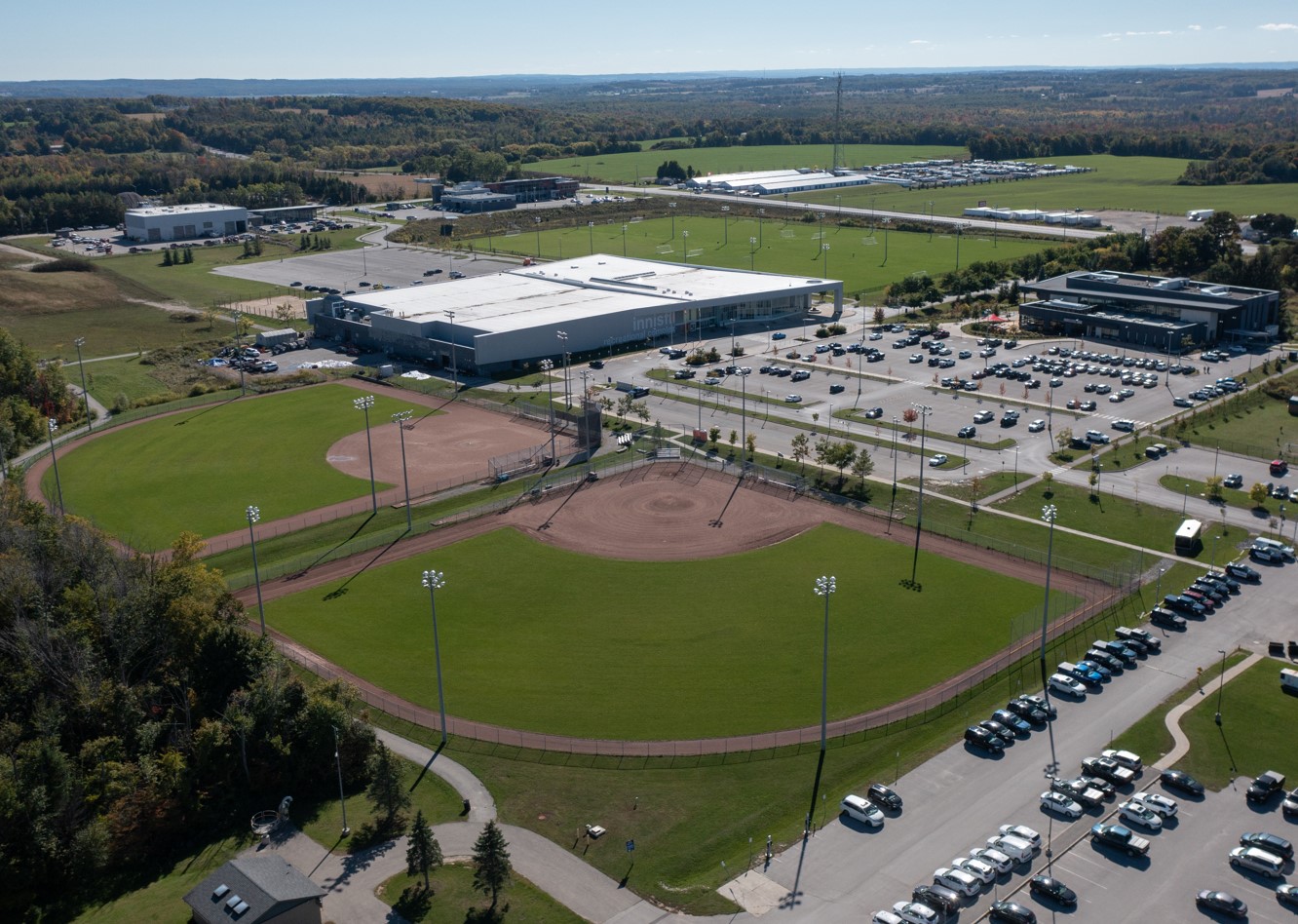Aerial view of baseball diamonds and recreational building