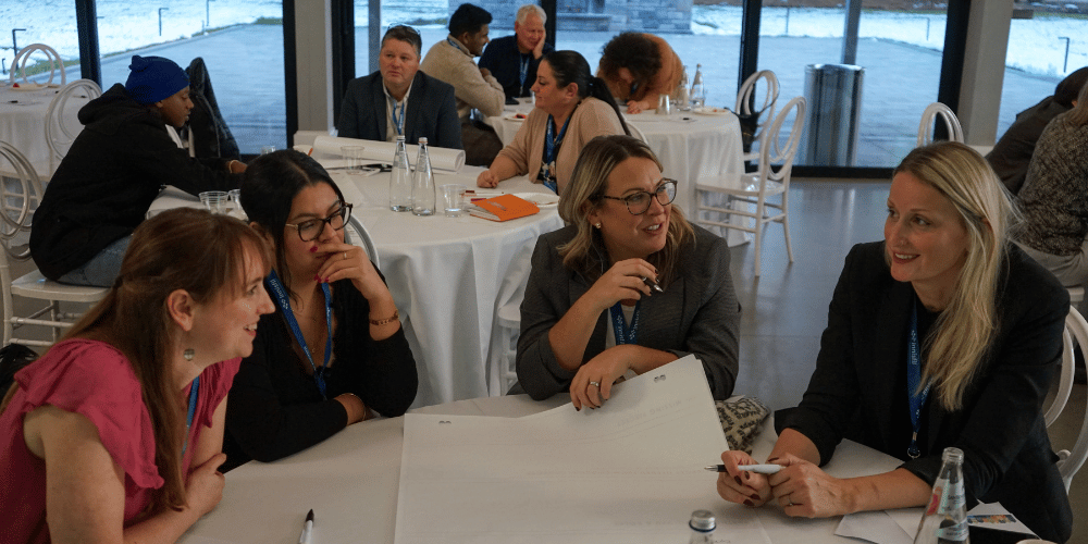 Group of local founders at the recent Innisfil Tourism Summit event working together to brainstorm ideas of new tourism experiences in the area.