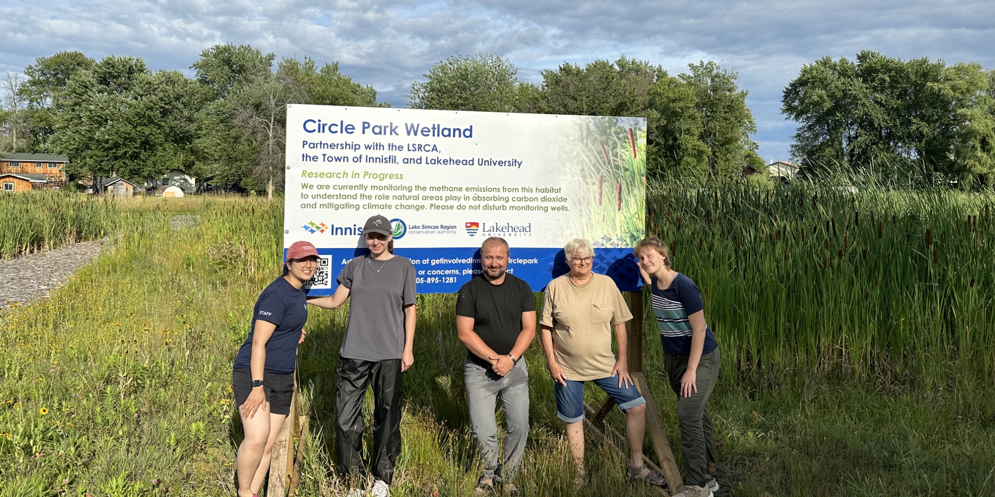 A group of student researchers from Lakehead University standing by Circle Creek in Gilford