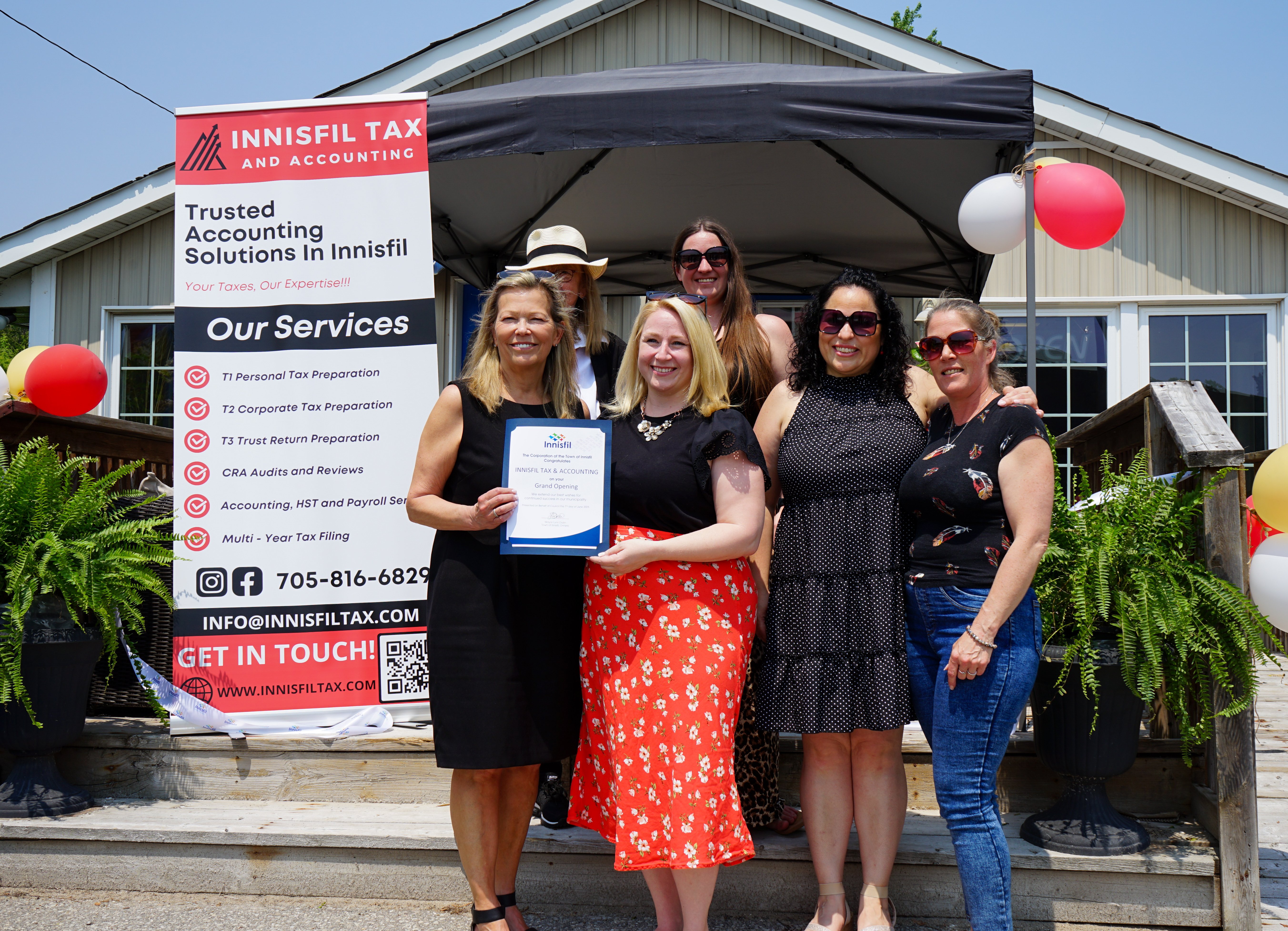 Mayor Dollin and staff of Innisfil Tax and Accounting celebrating the businesses grand opening.