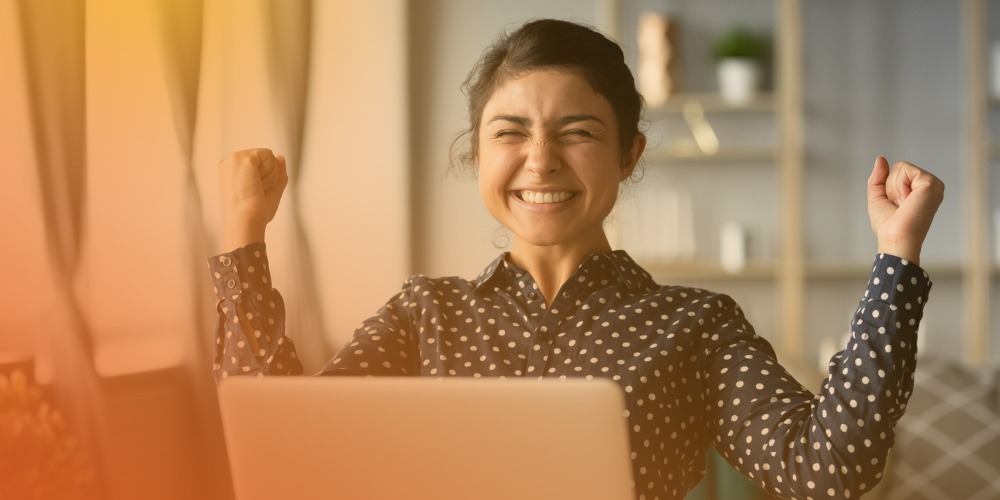 Happy young woman with laptop