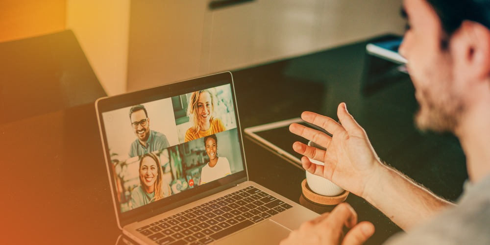 Man looking at computer screen during virtual meeting