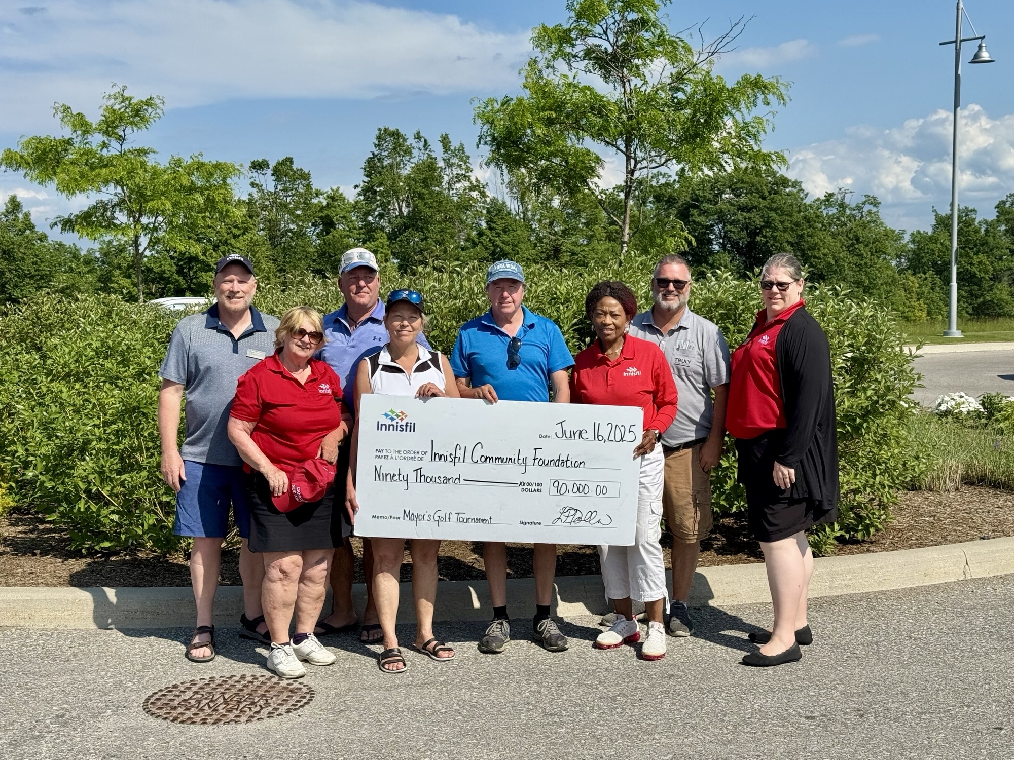 Town Council holding cheque for $90,000