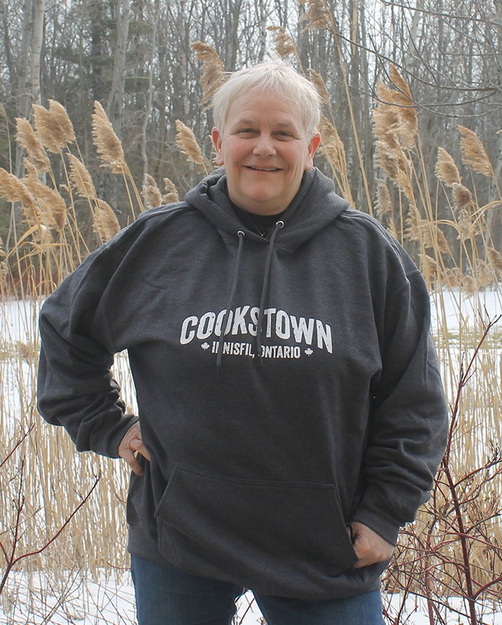 Girl wearing hoodie that says Cookstown