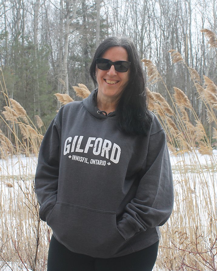 Girl wearing hoodie that says Gilford