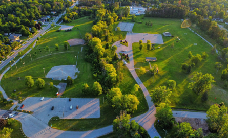 An aerial view of Innisfil Beach Park with green grass and trees