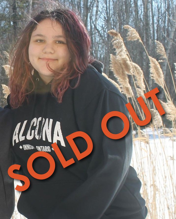Girl wearing hoodie that says Alcona - sold out