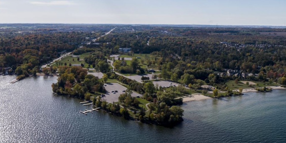 Aerial view of Innisfil Beach Park with water and trees