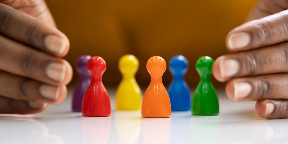 Woman holding different coloured game pieces