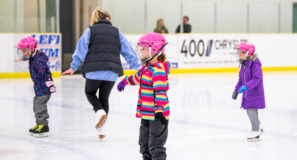 Kids skating at arena