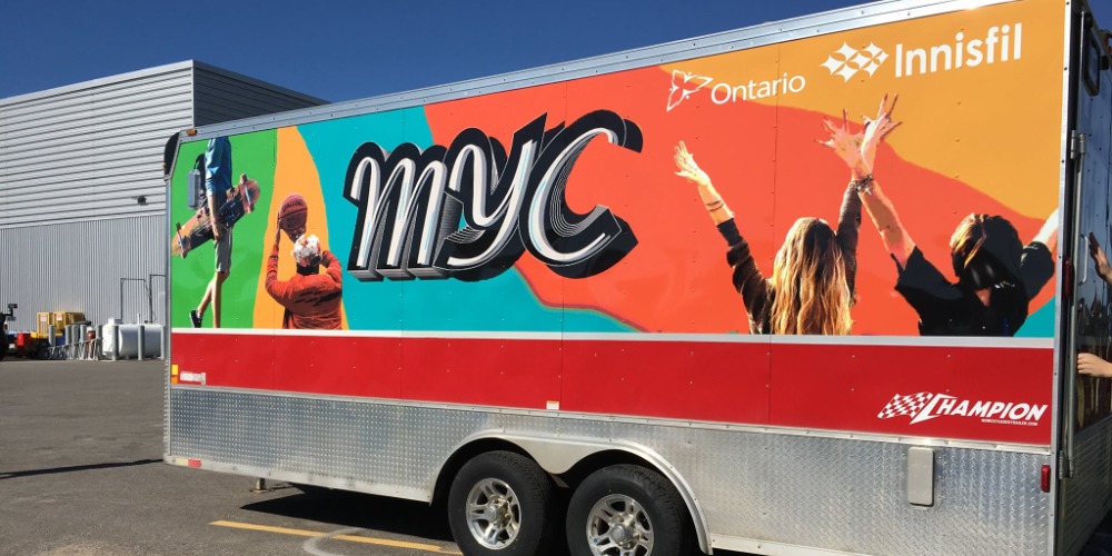 Trailer with the letters MYC on it