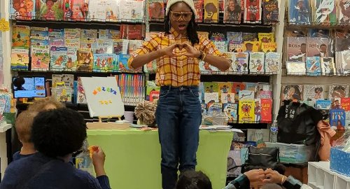 Ms. Love reading to children