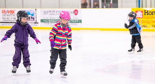 Children skating at arena