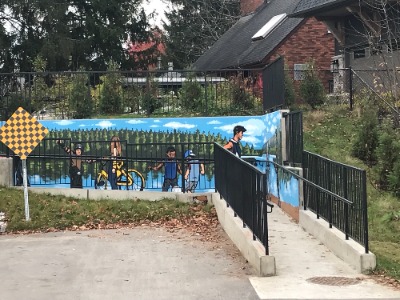 Mural on ramp showing diverse collection of people