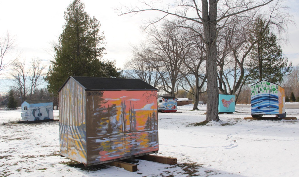 Ice fishing huts painted by artists