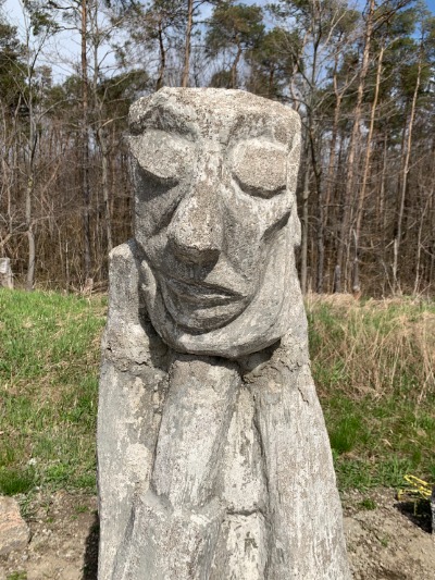 Stone sculpture of abstract face