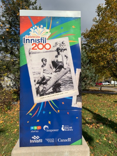Utility box wrapped with historical photos of Innisfil