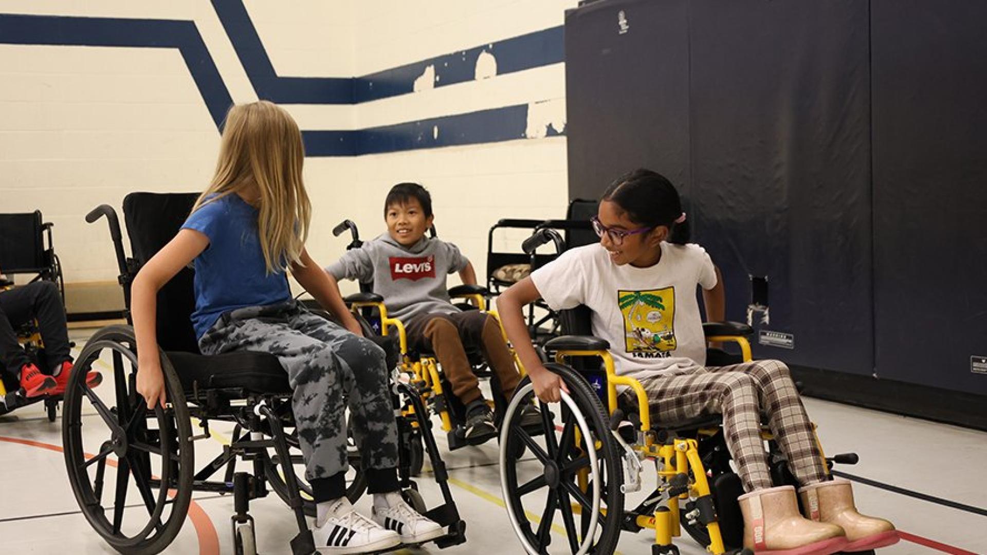 Children at Killarney Beach Public School learn how to navigate wheelchairs in public spaces during the Town of Innisfil Accessibility Advisory Committee Breaking Down Barriers Awareness educational workshop.