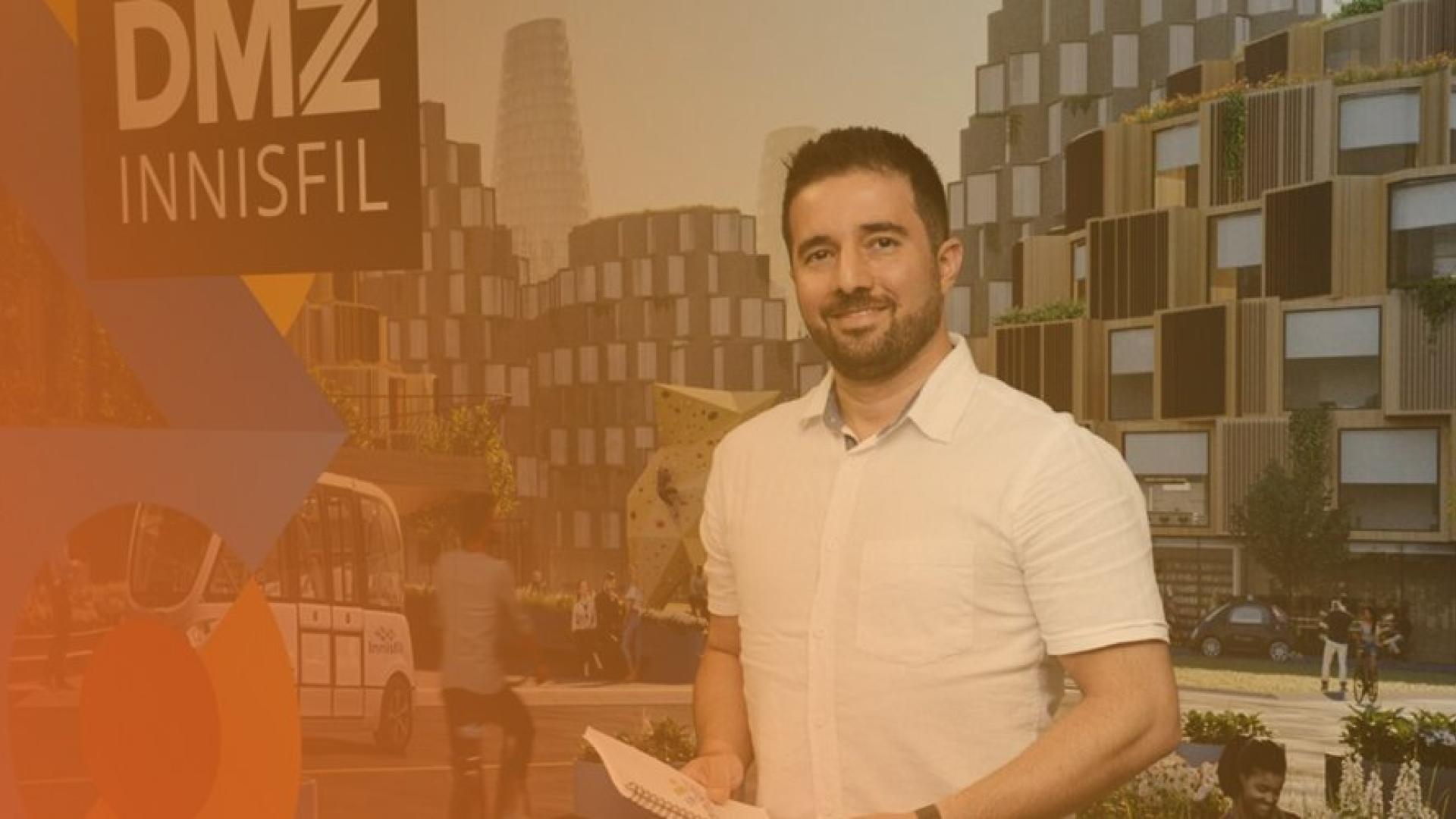 employee standing in front of DMZ Innisfil sign