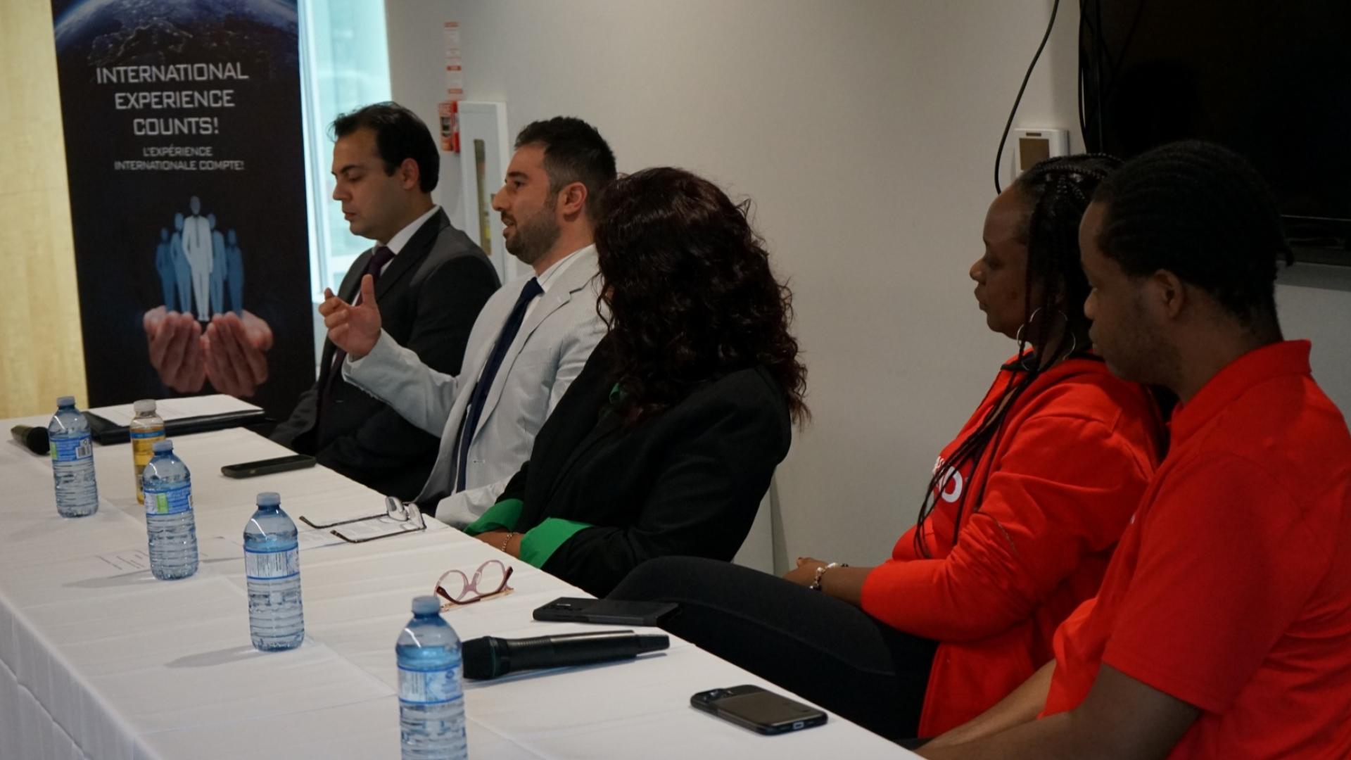 Panel of people speaking during presentation