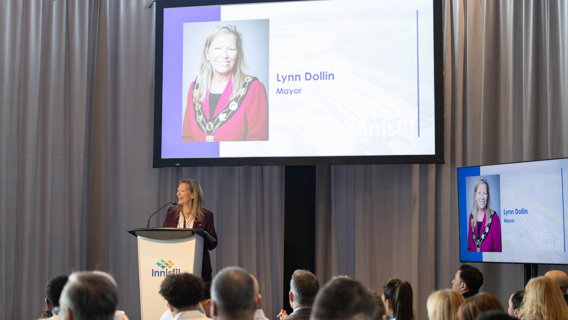 Mayor speaking to crowd at business breakfast