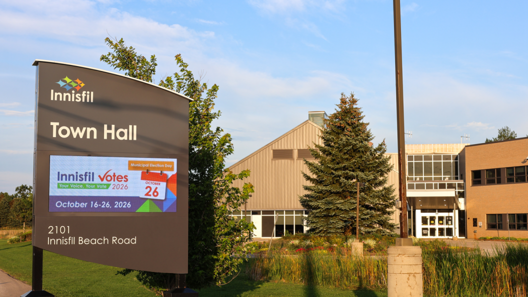 Outdoor sign stating voting period at Town Hall