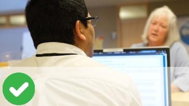 Customer service person talking to customer at front counter