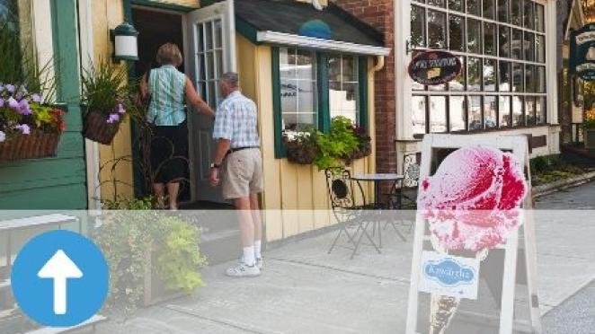 Couple walking into local shop