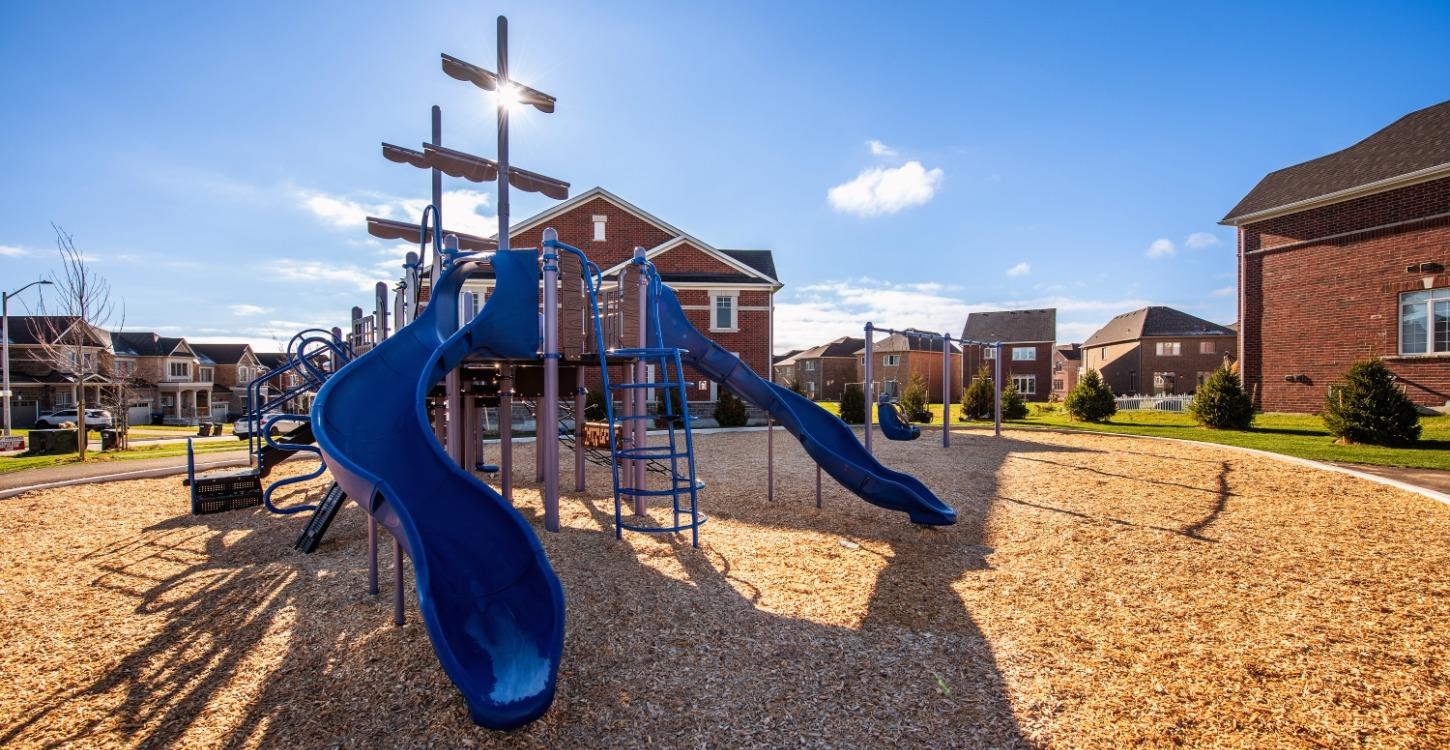 Playground with pirate-ship-like masts in a suburban park